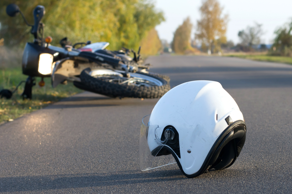 Photo of Helmet and Motorcycle on Road